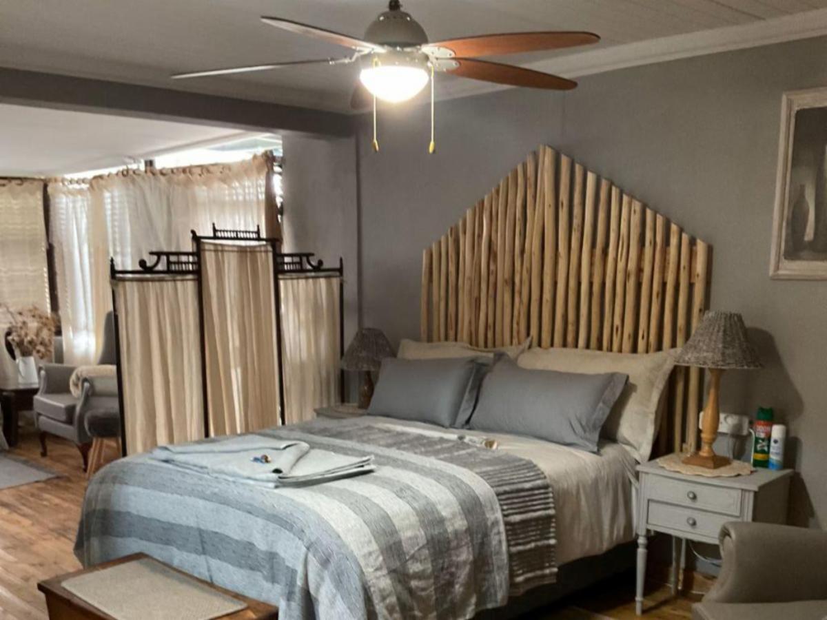 Luxury Suite bedroom with ceiling fan